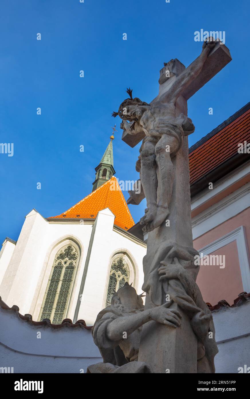 Church of the Sacrifice of the Virgin Mary with statue of Jesus Christ in the historic old town of Ceske Budejovice, ?eske Bud?jovice, South Stock Photo