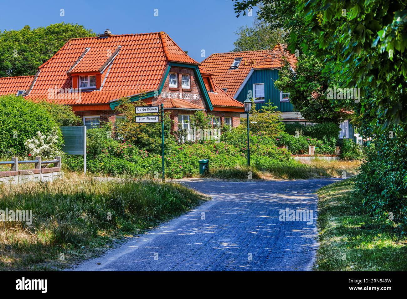 Village street with typical houses, Spiekeroog, North Sea spa, North Sea island, East Frisian Islands, Lower Saxony Wadden Sea, East Frisia, Lower Stock Photo