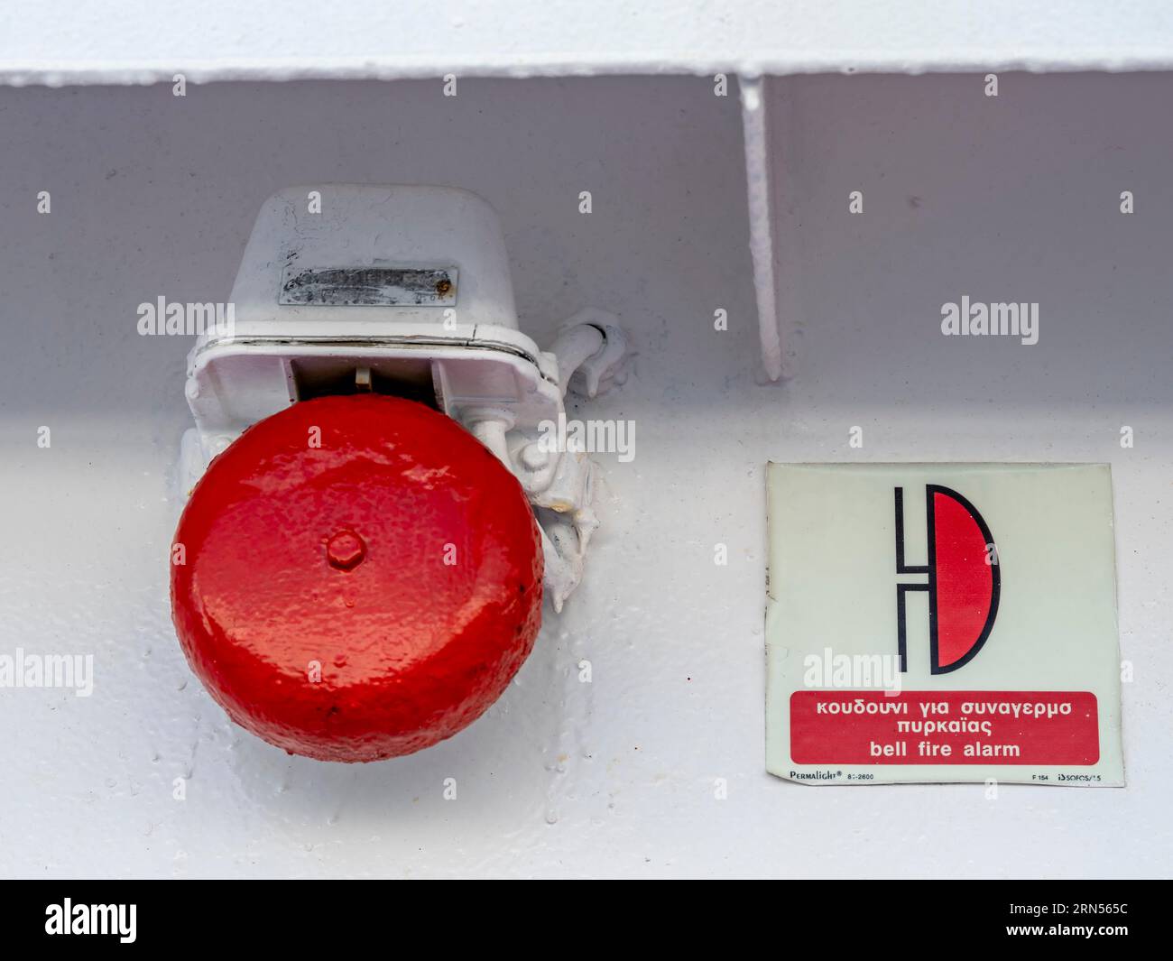 Red warning bell for fire alarm, on board a ferry, Cyclades, Greece Stock Photo Alamy
