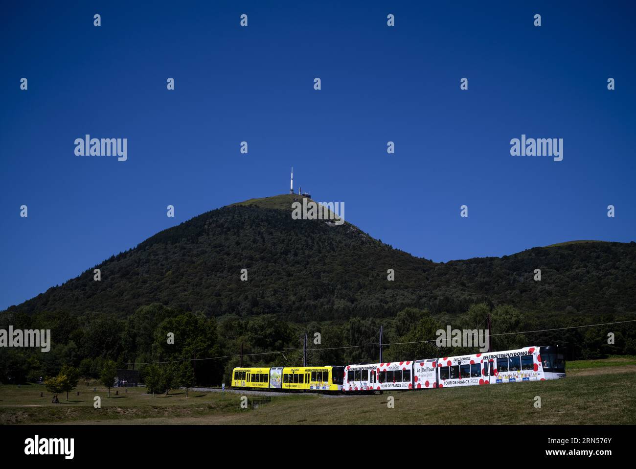 Panoramique des Domes cogwheel railway in Tour de France 2023 all-car advertising ascends Puy de Dome, radio station and observatory, Chaine des Stock Photo
