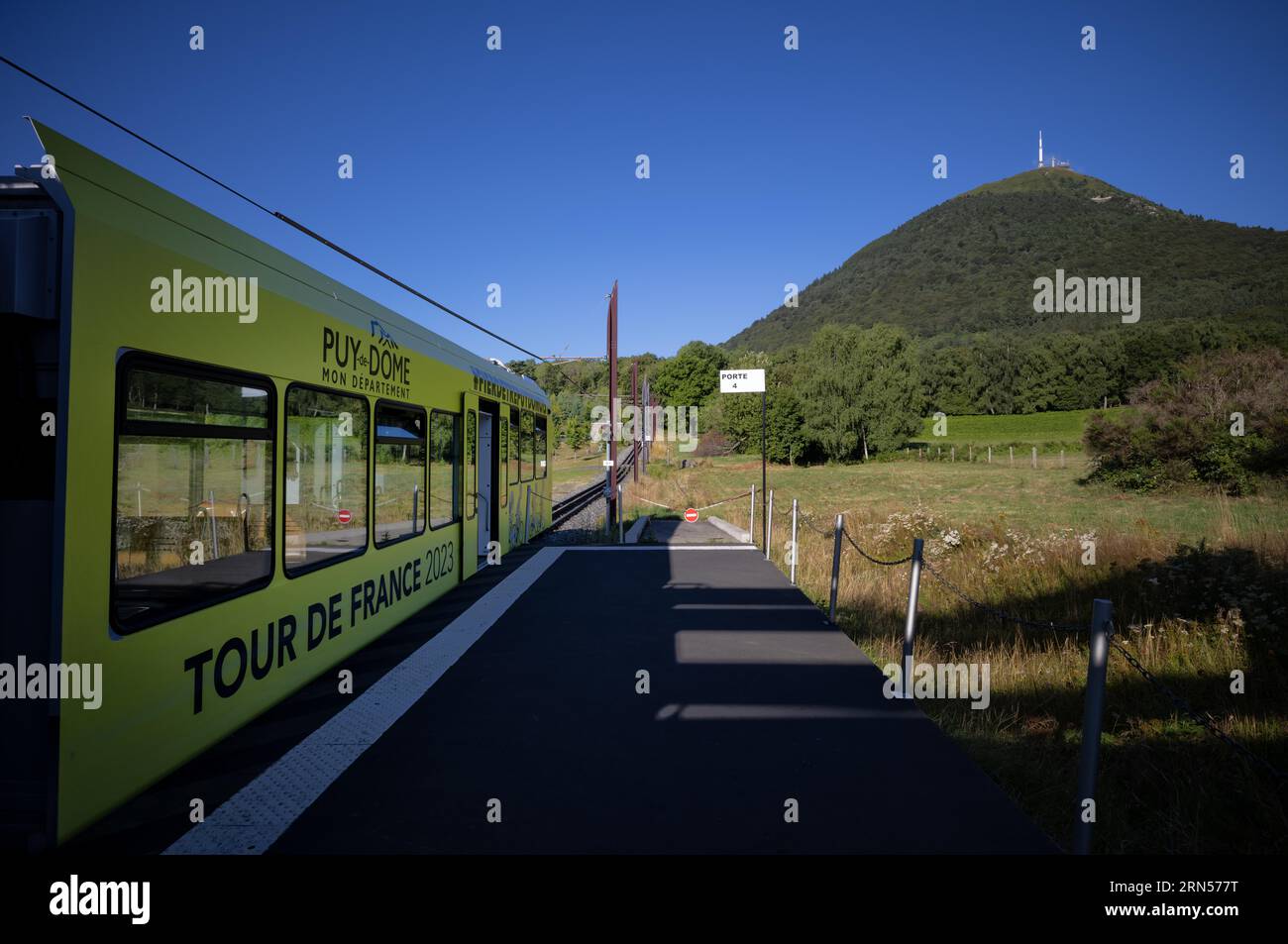 Bottom station of the Panoramique des Domes rack railway in Tour de France 2023 all-car advertising driving up Puy de Dome, radio station and Stock Photo