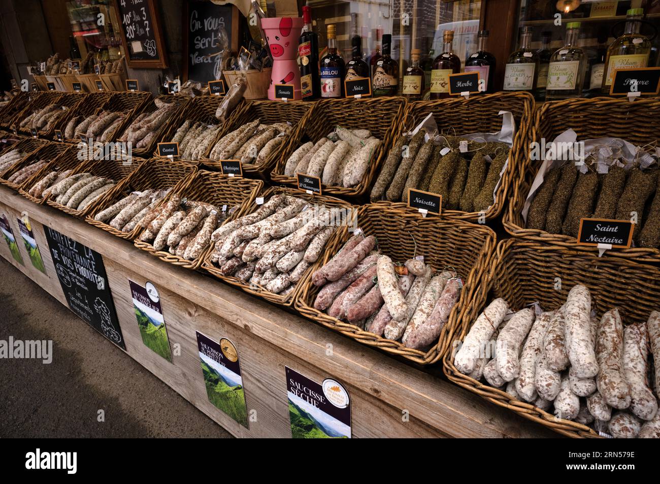 Display of regional products, sausages, salami, wine, Mont-Dore, Departement Puy-de-Dome, Region Auvergne-Rhone-Alpes, France Stock Photo