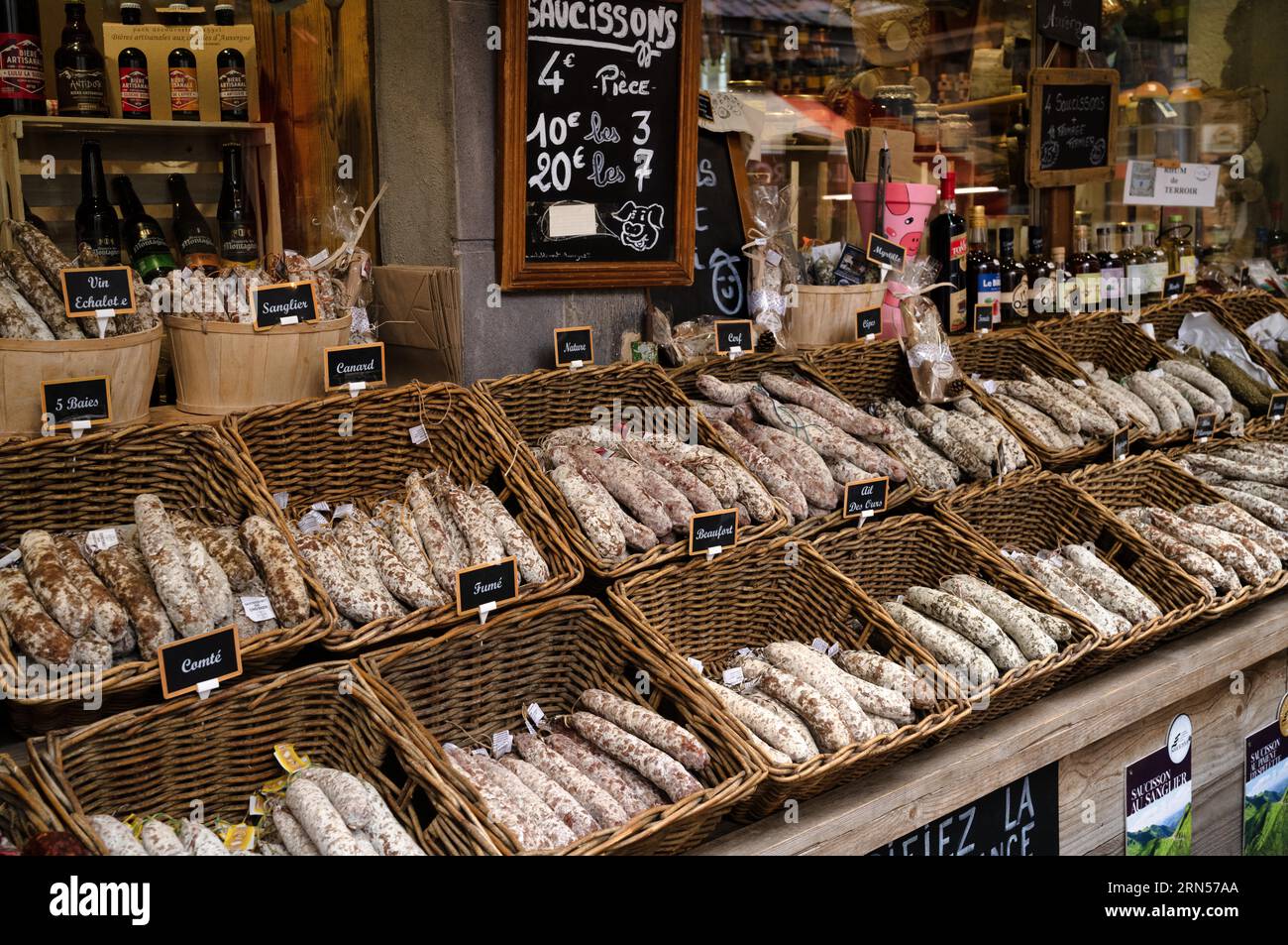 Display of regional products, sausages, salami, wine, Mont-Dore, Departement Puy-de-Dome, Region Auvergne-Rhone-Alpes, France Stock Photo