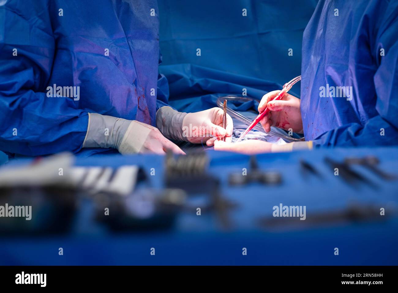 Two doctors perform an operation on a patient in a hospital Stock Photo ...