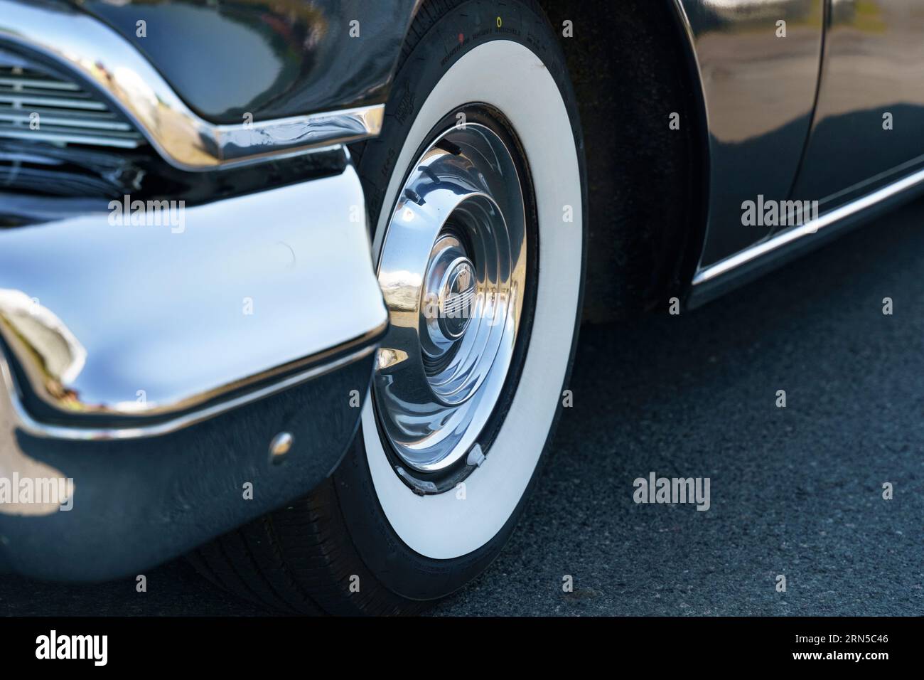 Waltershausen, Germany - June 10, 2023: A vintage American Oldsmobile Rocket Super 88 is parked in front of a Burgenland classic. View of the wheel an Stock Photo