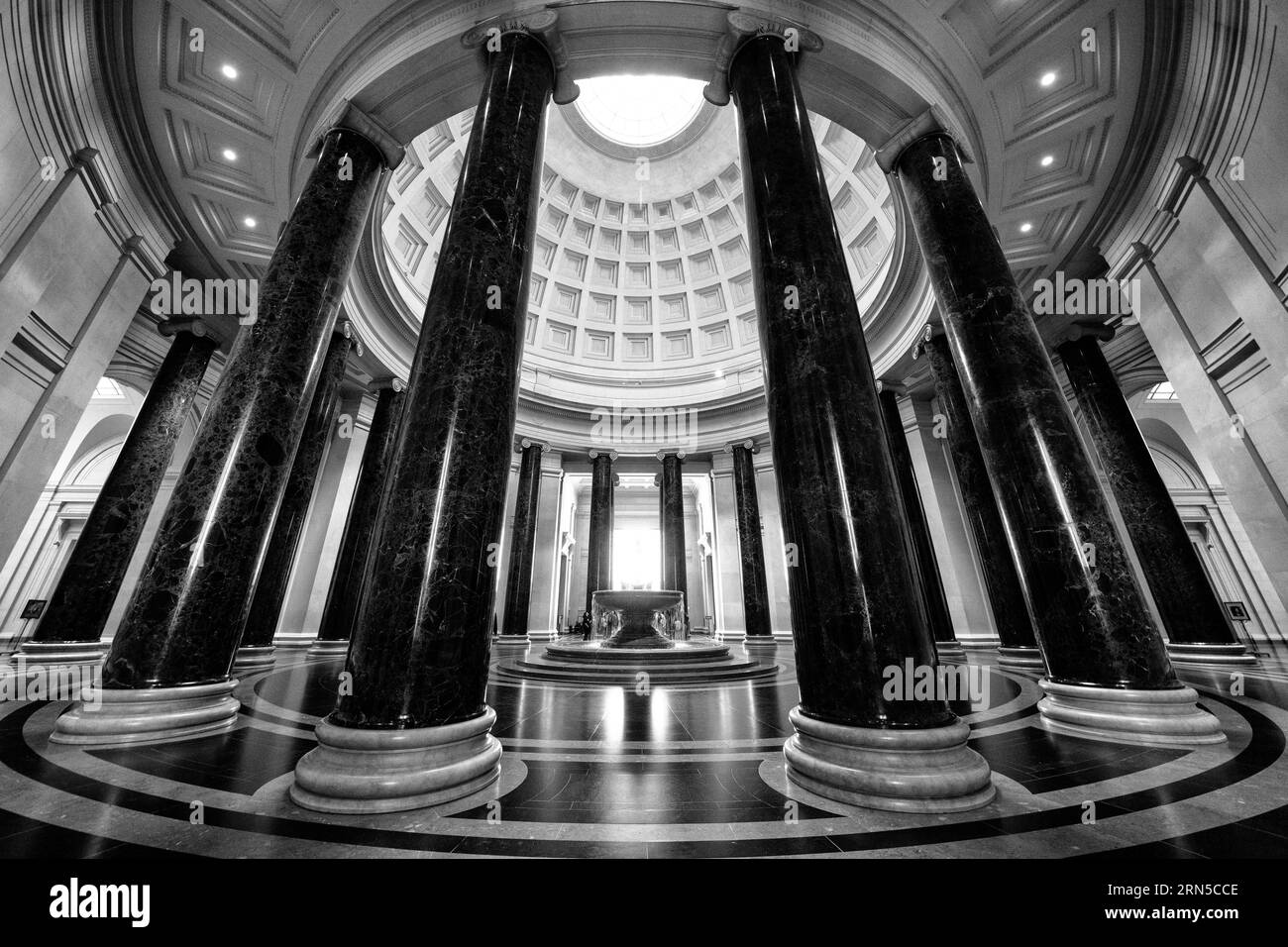 WASHINGTON DC, United States — A wide-angle photo of the interior of the rotunda at the heart of the National Gallery of Art in Washington DC. The rotunda of the National Gallery of Art shines with architectural details and ambient light. Serving as the heart of the gallery, this central space not only offers a calm respite for visitors but also exemplifies the institution's dedication to art and culture in the nation's capital. Stock Photo