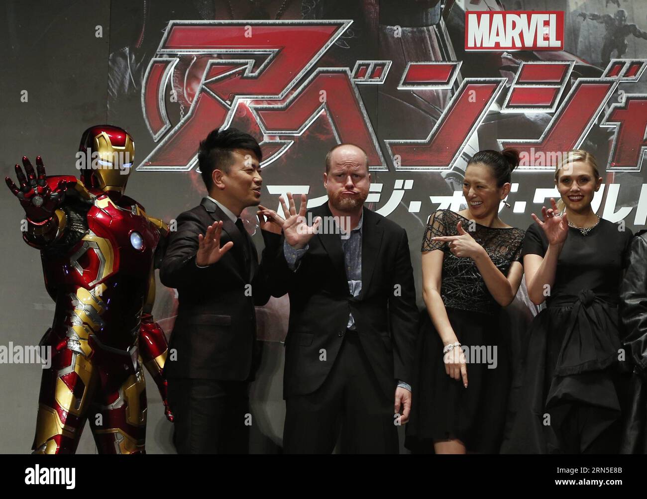 (150623) -- TOKYO, June 23, 2015 -- (L to R) Iron Man, Japanese comedian Hiroyuki Miyasako, film director Joss Whedon, Japanese actress Ryoko Yonekura, American actress Elizabeth Olsen pose for photographers during a premiere event for the new film Avengers: Age of Ultron in Tokyo, Japan, June 23, 2015. The film will be shown to the public from July 4 in Japan. )(dzl) JAPAN-TOKYO-MOVIE-AVENGERS Stringer PUBLICATIONxNOTxINxCHN   150623 Tokyo June 23 2015 l to r Iron Man Japanese Comedian Hiroyuki  Film Director Joss Whedon Japanese actress Ryoko Yonekura American actress Elizabeth Olsen Pose fo Stock Photo
