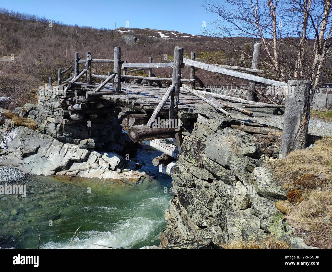 Old wooden bridge in Leirdalen, Jotunheimen National Park, Norway Stock Photo