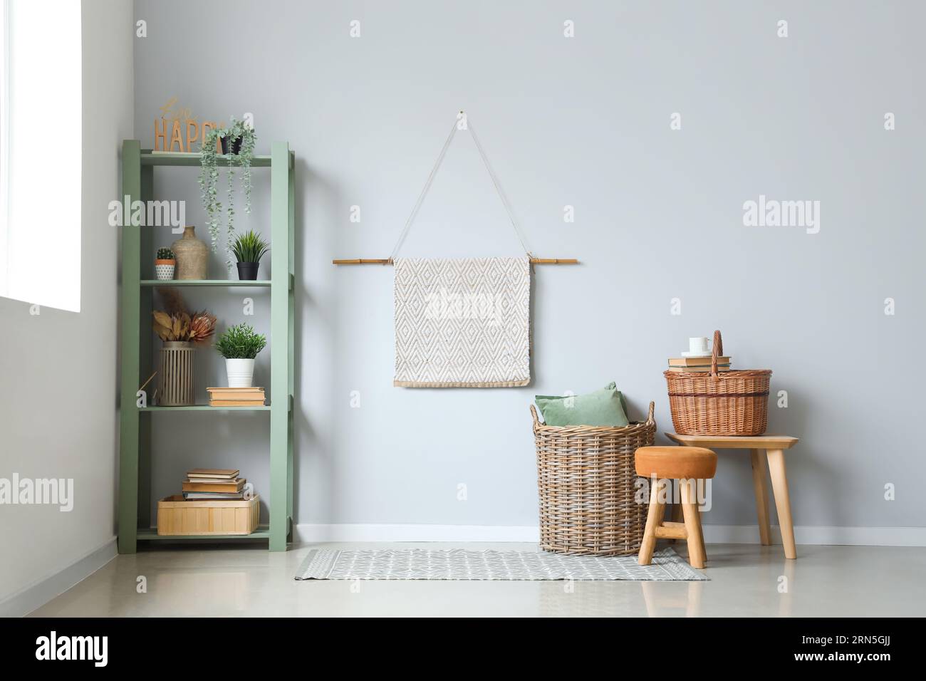 Picture of Interior of living room with wicker baskets and shelving unit Stock ...