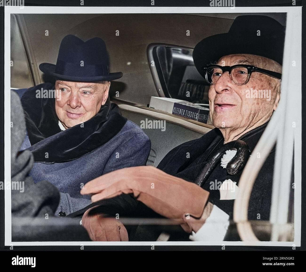 Sir Winston Churchill, British statesman, and Bernard Baruch, financier, converse in the back seat of a car in front of Baruch's home. 14th April 1961 Stock Photo