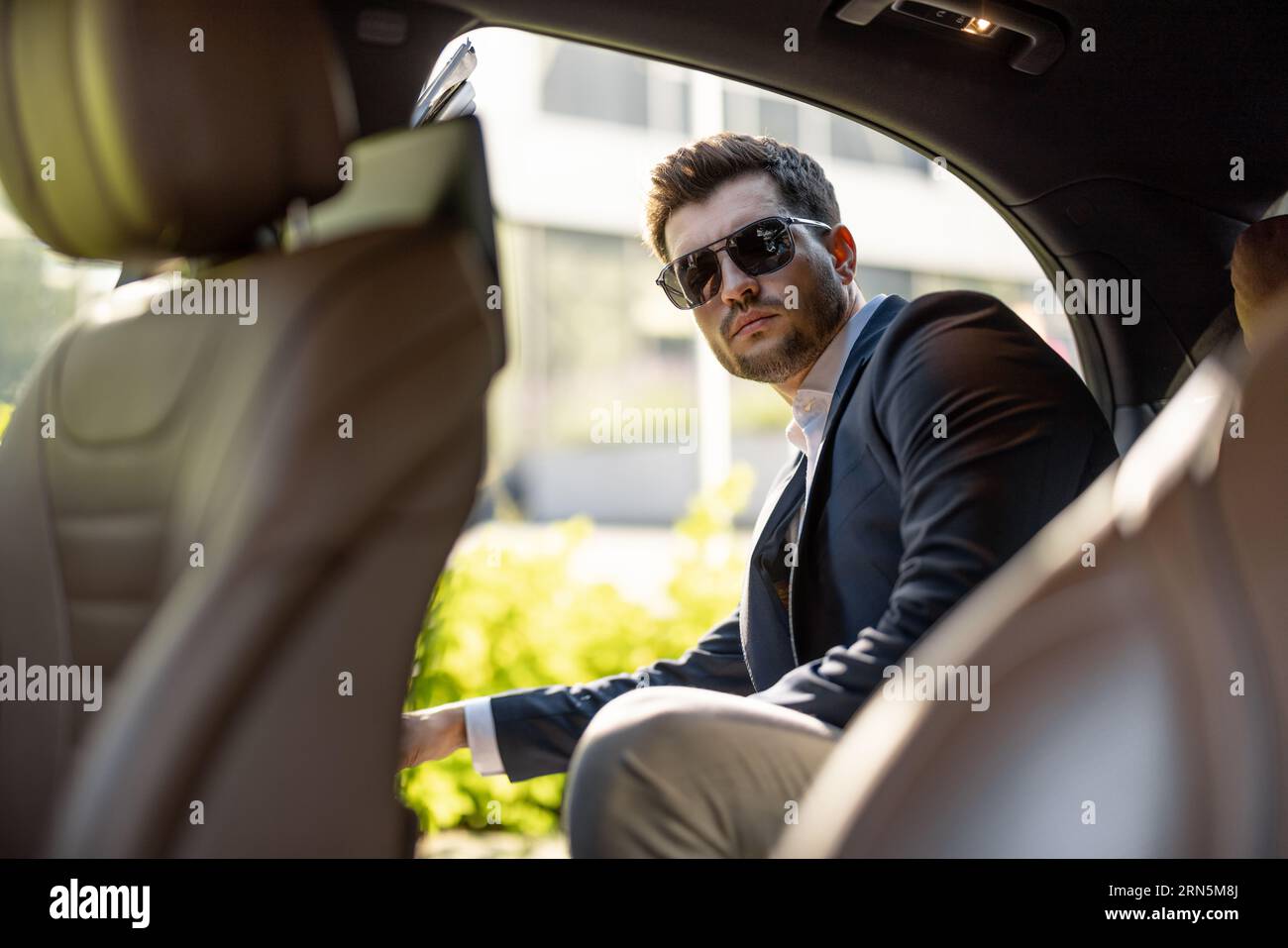 Businessman getting in the car Stock Photo