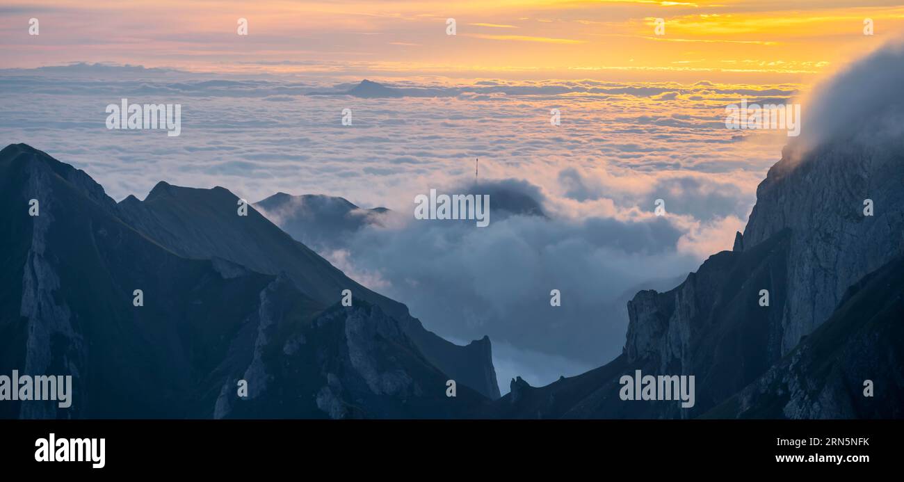 Sunrise, mountains in the fog, Saentis, Appenzell Ausserrhoden, Appenzell Alps, Switzerland Stock Photo
