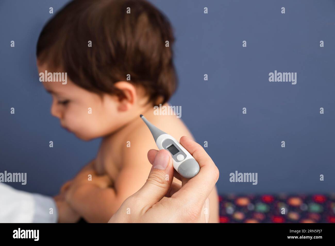 Close up doctor checking baby temperature Stock Photo Alamy