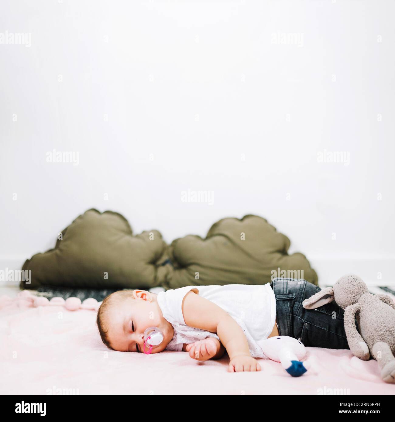 Cute baby sleeping peacefully nursery floor Stock Photo Alamy