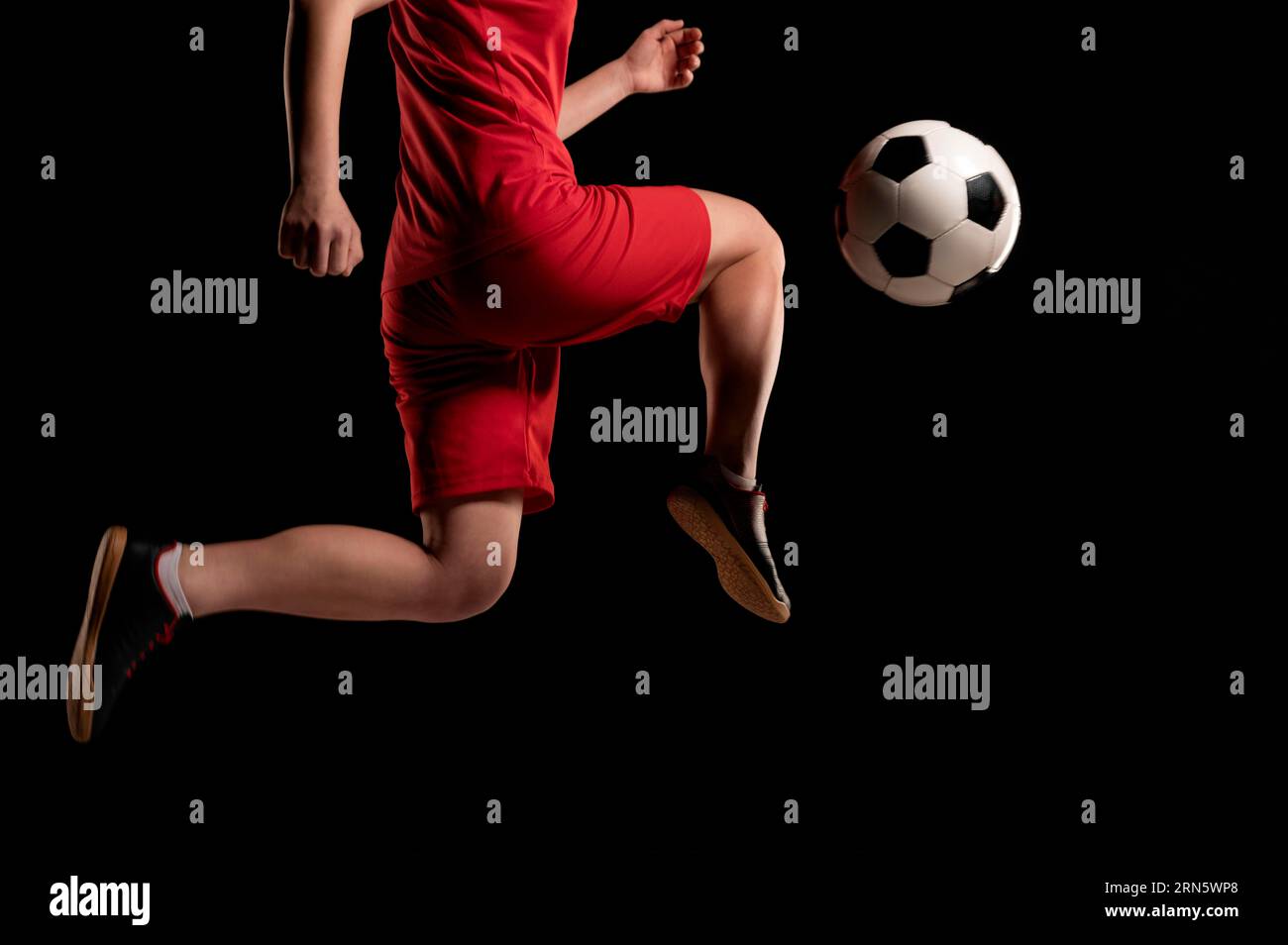 Person kicking ball with the knee hi-res stock photography and images -  Alamy