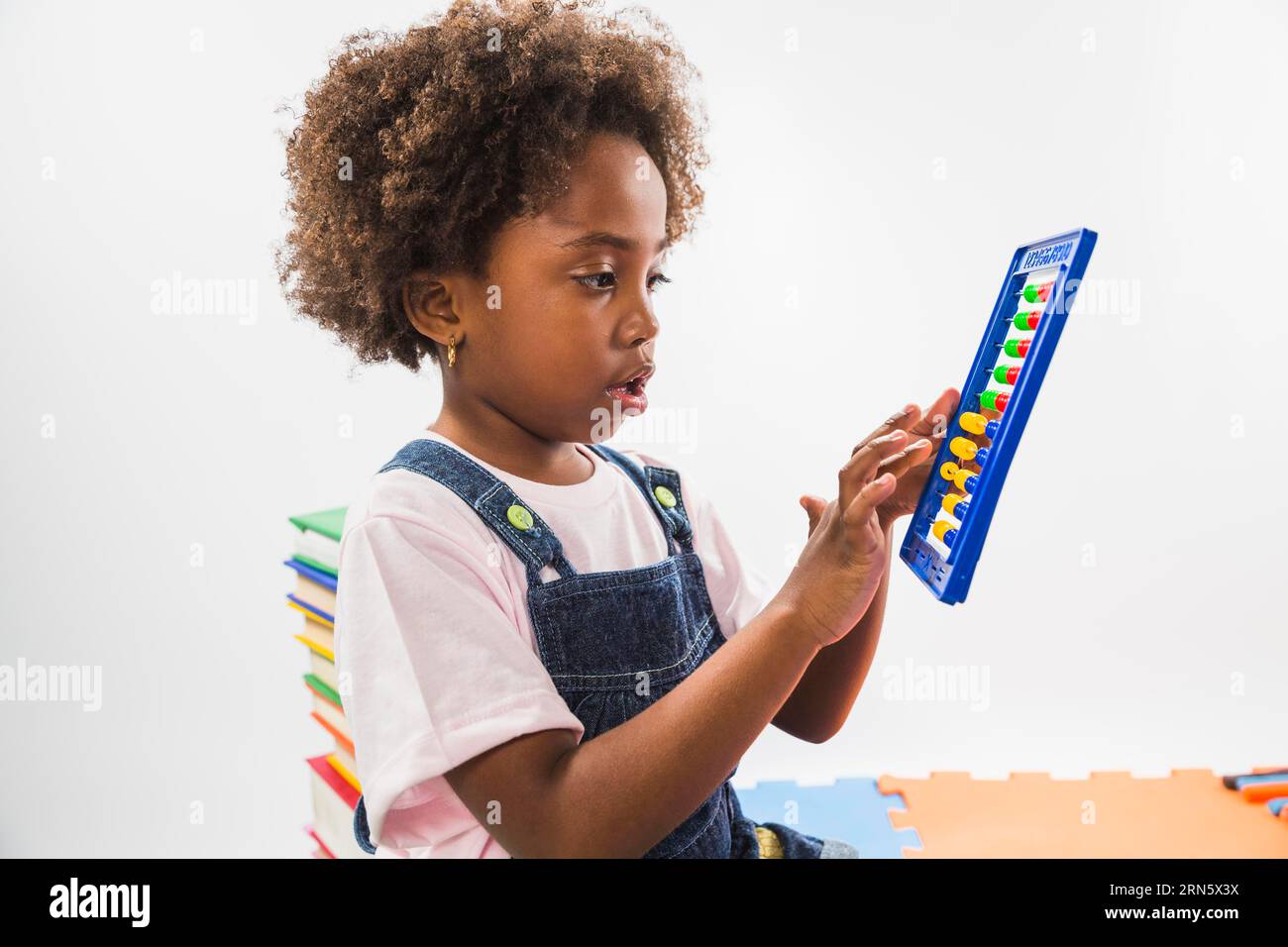 Cute kid with abacus studio Stock Photo