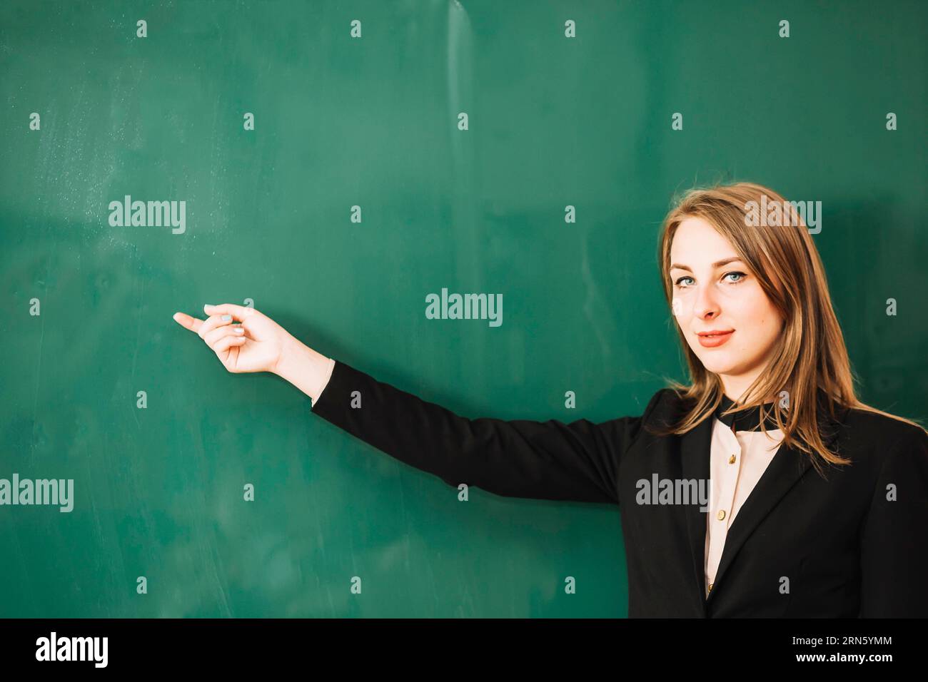 Teacher looking camera Stock Photo