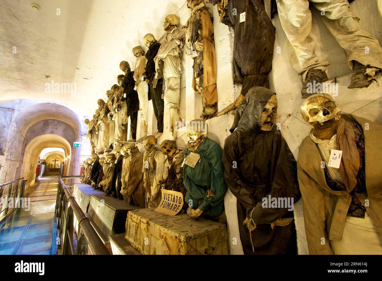 Exit area, super wide angle, aisle, Vietato Fumare sign, two rows of mummies on top of each other, Catacombe dei Cappuccini, Capuchin monastery Stock Photo
