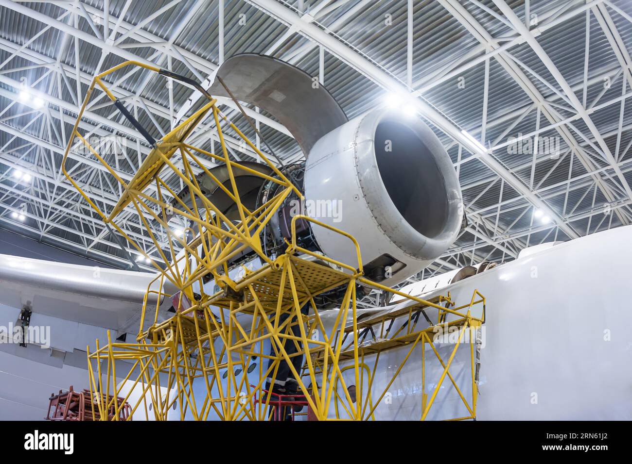 Open high-bypass turbofan aircraft engine of a transport airplane in a hangar Stock Photo