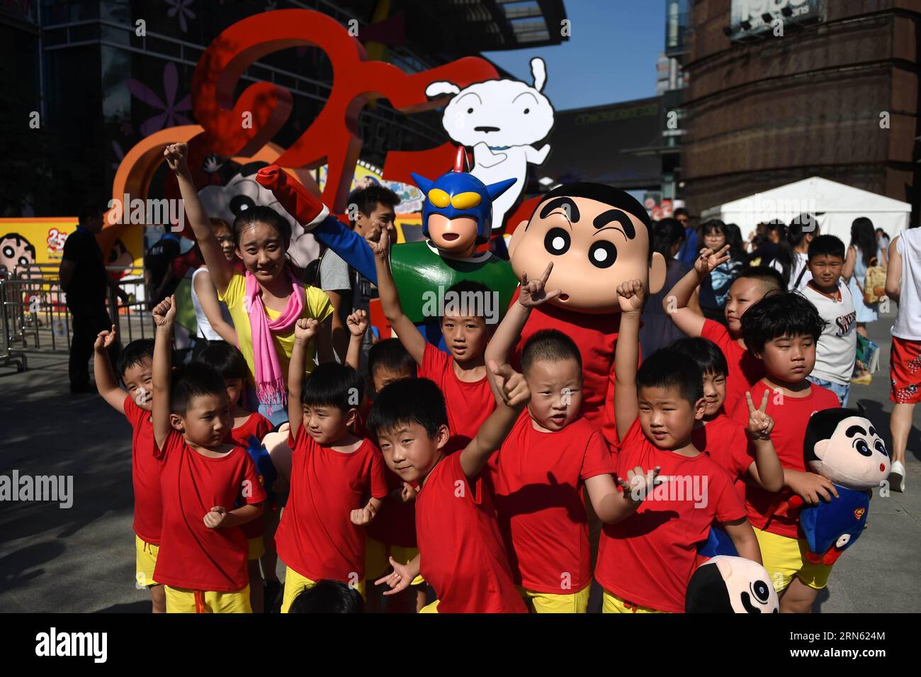 (150708) -- SHENYANG, July 8, 2015 -- Children pose with cartoon figures during the launching ceremony of the exhibition marking the 25th anniversary of Japanese manga series Crayon Shin-chan in Shenyang, northeast China s Liaoning Province, July 8, 2015. The exhibition will be open to public on July 11. ) (zkr) CHINA-SHENYANG-CRAYON SHIN-CHAN-25TH ANNIVERSARY(CN) PanxYulong PUBLICATIONxNOTxINxCHN   150708 Shenyang July 8 2015 Children Pose With Cartoon Figures during The Launching Ceremony of The Exhibition marking The 25th Anniversary of Japanese Manga Series crayon Shin Chan in Shenyang Nor Stock Photo