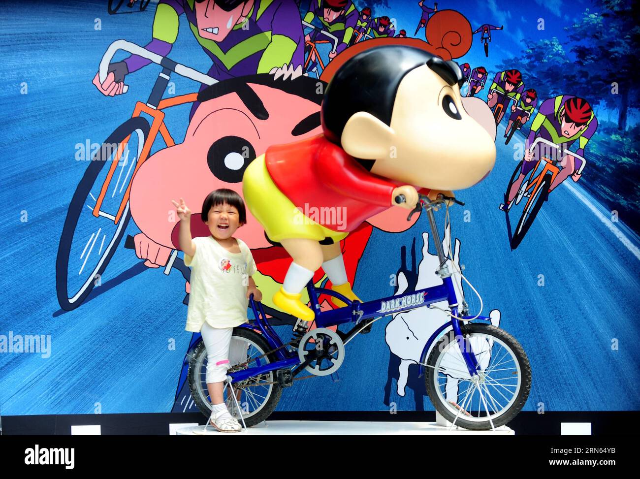 (150711) -- SHENYANG, July 11, 2015 -- A girl plays at an exhibition marking the 25th anniversary of Japanese manga series Crayon Shin-chan in Shenyang, northeast China s Liaoning Province July 11, 2015. Dozens of manga and theatrical version of Crayon Shin-chan and related figures were displayed on the exhibition that opened to public on Saturday. (mcg) CHINA-SHENYANG-CRAYON SHIN-CHAN-25TH ANNIVERSARY(CN) ZhangxWenkui PUBLICATIONxNOTxINxCHN   150 711 Shenyang July 11 2015 a Girl PLAYS AT to Exhibition marking The 25th Anniversary of Japanese Manga Series crayon Shin Chan in Shenyang Northeast Stock Photo
