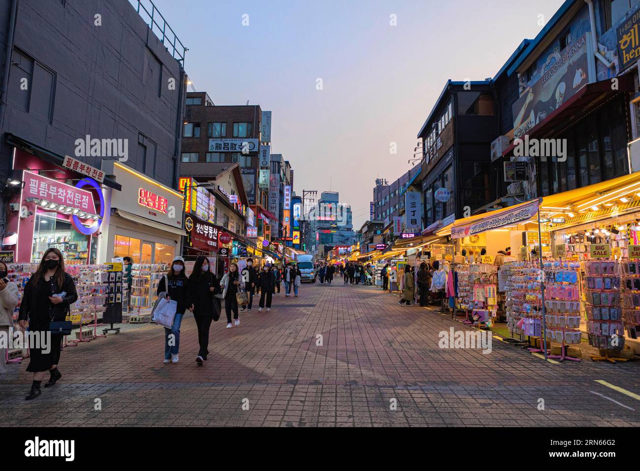 Colourful shops in the evening, neon signs, Hongdae student district, Seoul Stock Photo