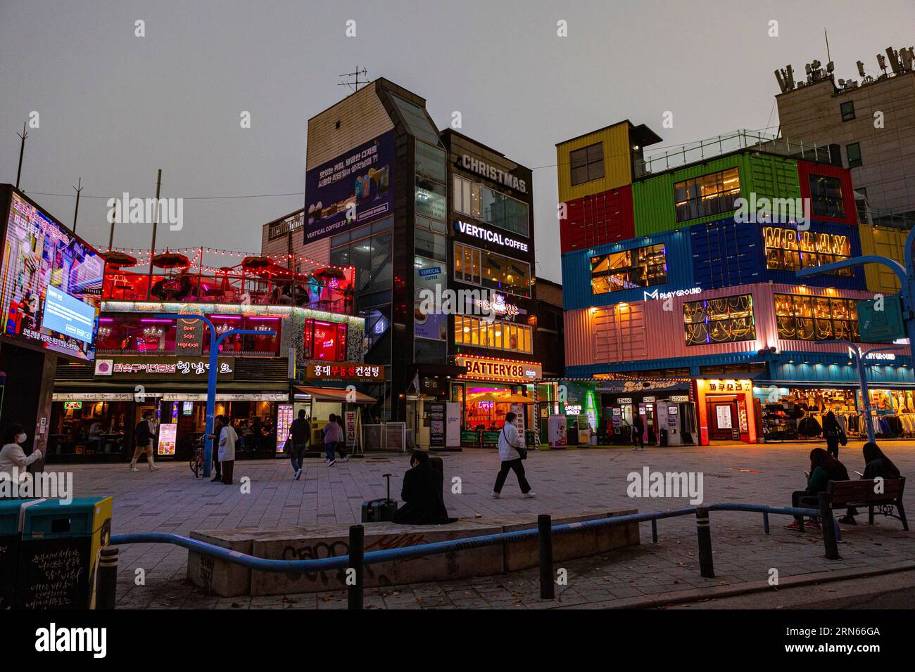 Bars, restaurants, shops in the evening, neon signs, Hongdae student district, Seoul Stock Photo