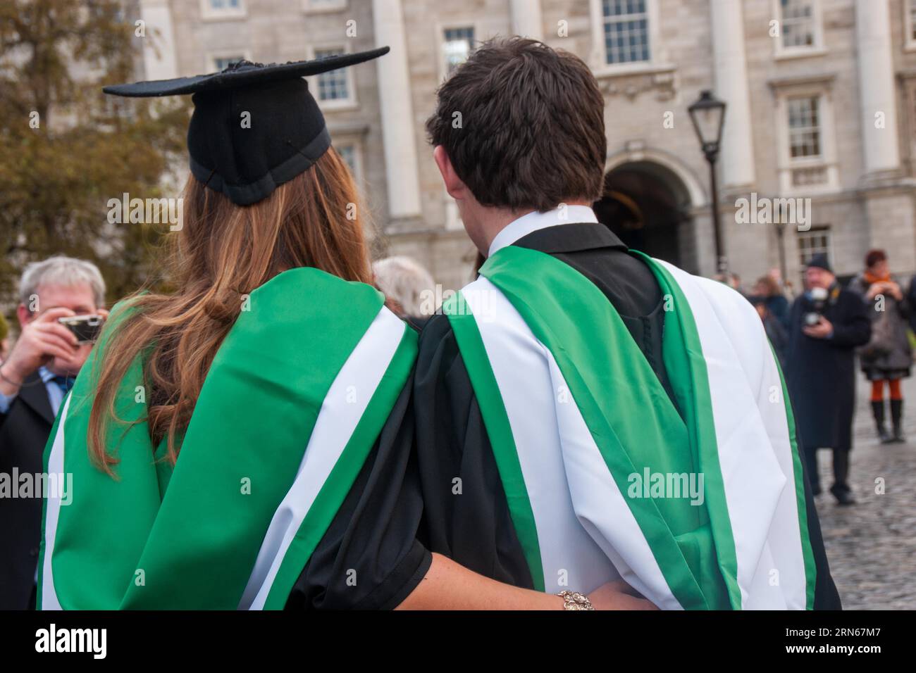 Graduates pose for family photos in Trinity College on graduation day
