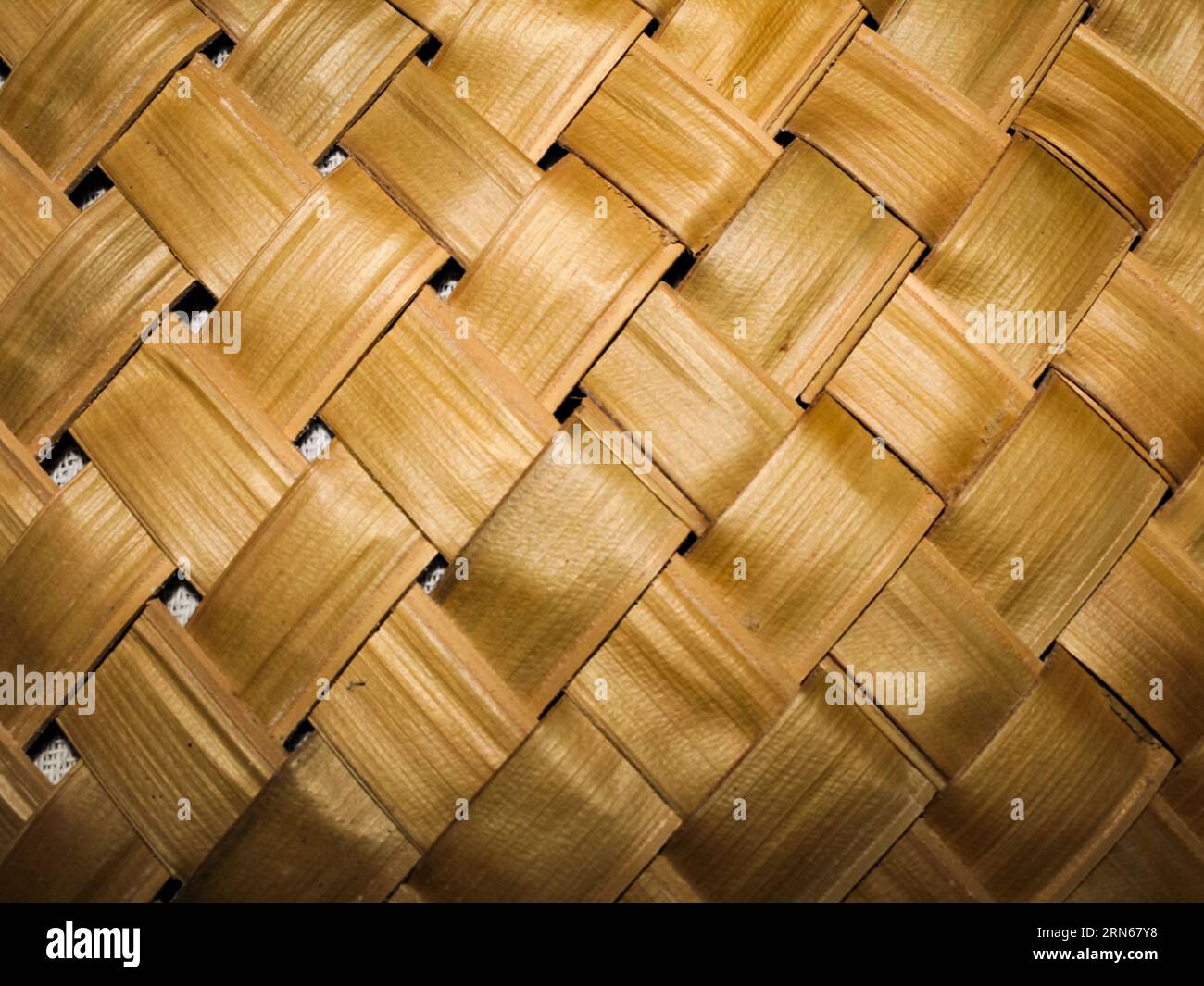 Detail of the mat, woven with natural palm leaf straw, intertwined