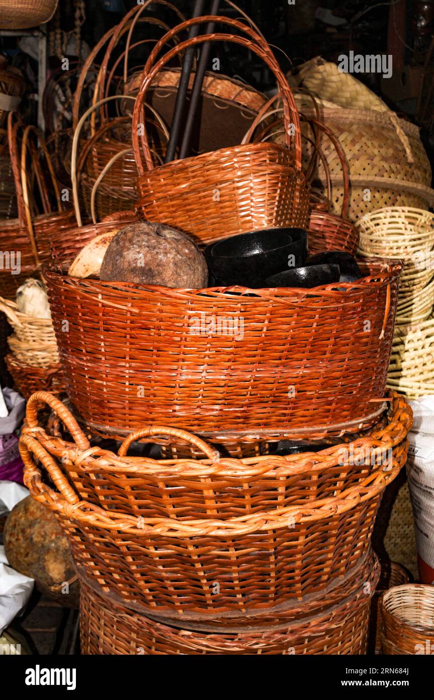 A pile of handmade picnic baskets made from plant fibers Stock Photo