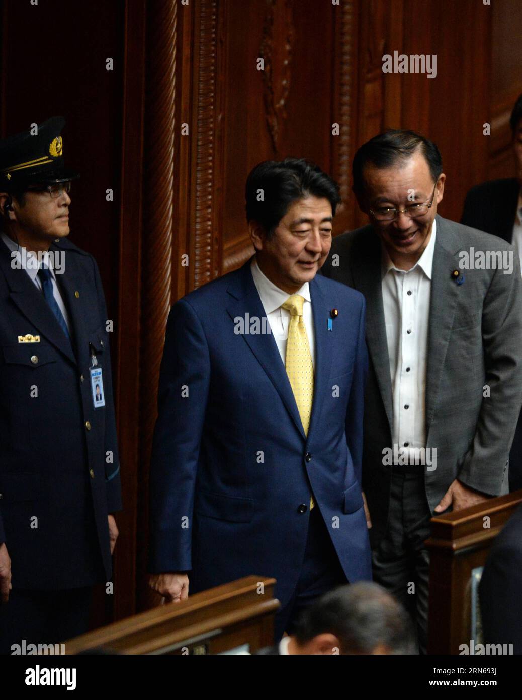 (150716) -- TOKYO, July 16, 2015 -- Japanese Prime Minister Shinzo Abe (C) and Sadakazu Tanigaki (R), secretary general of the Liberal Democratic Party, arrive at the lower house plenary in Tokyo, Japan, on July 16, 2015. Japan s ruling coalition led by Prime Minister Shinzo Abe on Thursday rammed through a series of controversial security bills in the all-powerful lower house of the nation s Diet amid strong public opposition, marking the most significant overturn of the nation s purely defensive defense posture. ) JAPAN-TOKYO-LOWER HOUSE-SECURITY BILLS-PASS MaxPing PUBLICATIONxNOTxINxCHN   1 Stock Photo