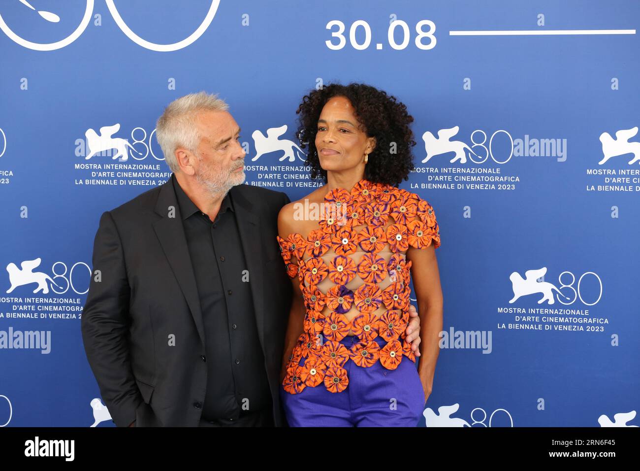 Venice, Italy, 31st August, 2023. Director Luc Besson and producer Virginie Besson-Silla at the photo call for the film Dogman at the 80th Venice International Film Festival. Photo Credit: Doreen Kennedy / Alamy Live News. Stock Photo