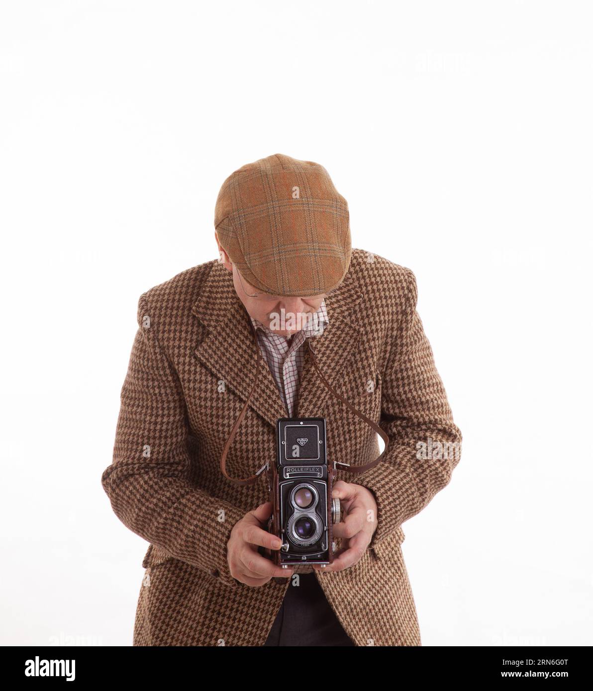 A mature Englishman photographer in classic tweeds Stock Photo