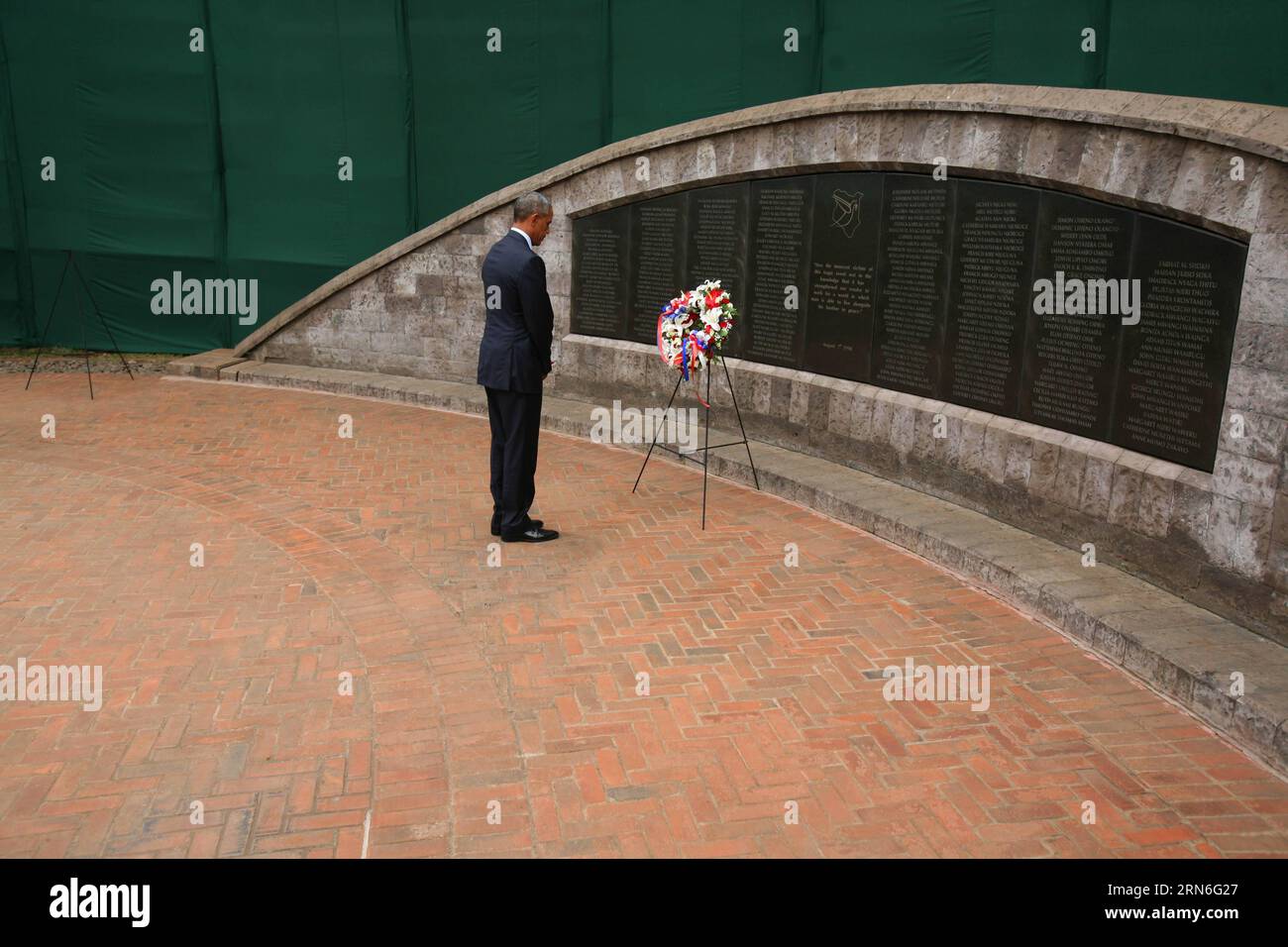 U.S. President Barack Obama stands in silent tribute after laying a wreath at the August 7th Memorial Park to pay tribute to the victims of the August 7, 1998 bomb blast at U.S. Embassy in Nairobi, Kenya on July 25, 2015. On August 7, 1998, the U.S. embassy in Kenya was bombed by an Al- Qaida linked terror group, where over 200 people lost their lives while approximately 5,000 sustained injuries. ) KENYA-NAIROBI-U.S.-OBAMA-VISIT JohnxOkoyo PUBLICATIONxNOTxINxCHN   U S President Barack Obama stands in Silent Tribute After Laying a Wreath AT The August 7th Memorial Park to Pay Tribute to The Vic Stock Photo