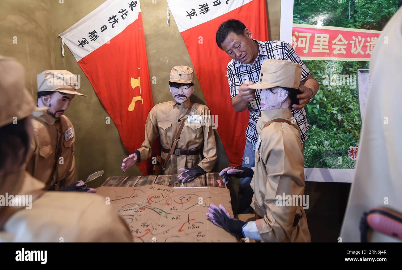 (150729) -- TONGHUA, July 29, 2015 -- Liu Fu, the museum founder, arranges his exhibits at a memorial museum for the resistant forces fighting in enemy-occupied regions during China s war of resistance against Japanese aggression, in Tonghua, northeast China s Jilin Province, July 29, 2015. Liu Fu, a 54-year-old local villager in Tonghua, is a grandchild of an officer of the Northeast Anti-Japanese Allied Army led by General Yang Jingyu. Liu built the memorial museum at his own expense to mark the 70th anniversary of the victory of China s war of resistance against Japanese aggression, which l Stock Photo