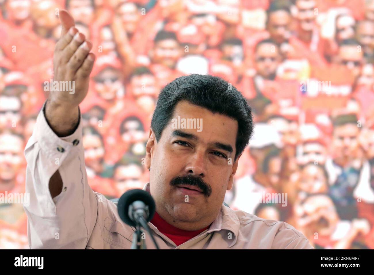 Image provided by Venezuela s Presidency shows Venezuelan President Nicolas Maduro delivering a speech during the meeting with workers of Orinoco Belt, at the Morichal Oilfield, state of Monagas, Venezuela, on Aug. 1, 2015. According to local press, Maduro praised on Saturday the Orinoco Belt as the most important project for the economic future and the integral development of Venezuela with a production of 1,326,000 daily barrels of oil, during a day of work in the Morichal Oilfield concerning the plan of the relaunch and repositioning of the plan of integral development of the Orinoco Belt. Stock Photo