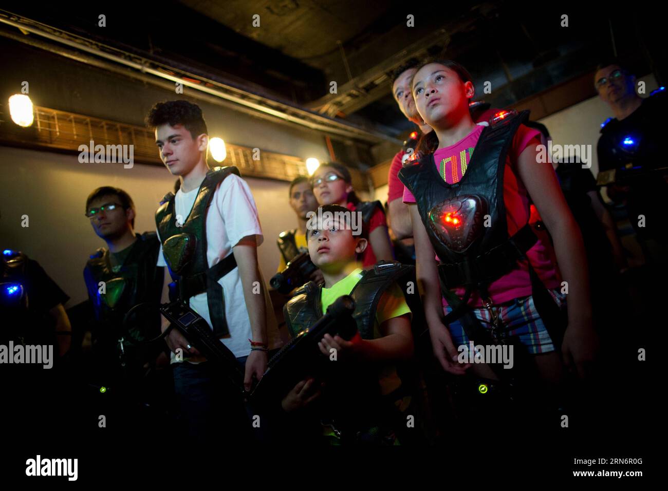 People take part in the Ghostbusters attraction, in the Six Flags 