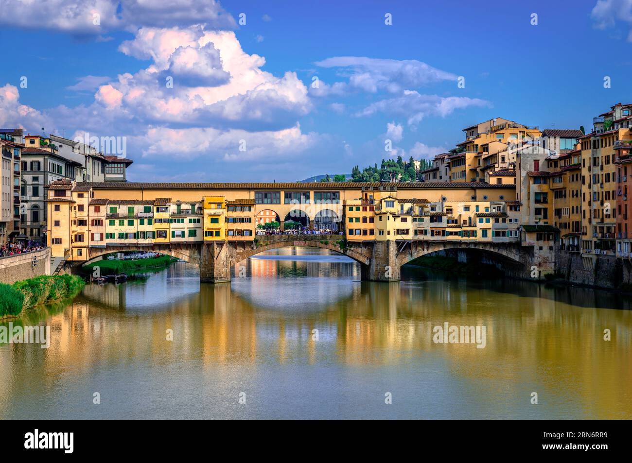Ponte Vecchio (old Bridge) in Florence, Italy. This medieval stone bridge that spans river Arno, consists of three segmental arches and it has always Stock Photo