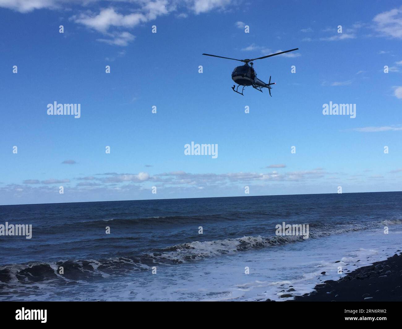 (150806) -- THE REUNION ISLAND, Aug. 6, 2015 -- A helicopter searchs over the sea on Reunion Island, on Jul.30, 2015. Verification had confirmed that the debris discovered on Reunion Island belongs to missing Malaysian Airlines flight MH370, Malaysian Prime Minister Najib Razak announced early Thursday. ) (jmmn) THE REUNION ISLAND-MH 370 FLIGHT-DEBIRS RomainxLatournerie PUBLICATIONxNOTxINxCHN   150806 The Reunion Iceland Aug 6 2015 a Helicopter search Over The Sea ON Reunion Iceland ON JUL 30 2015 Verification had confirmed Thatcher The debris discovered ON Reunion Iceland belongs to Missing M Stock Photo