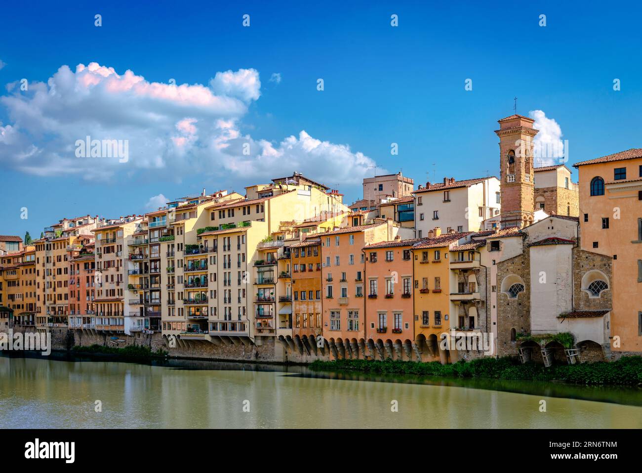View of Lungarno degli Acciaiuoli. Old buildings by the northern bank of river Arno in the afternoon, on a sunny day. Stock Photo