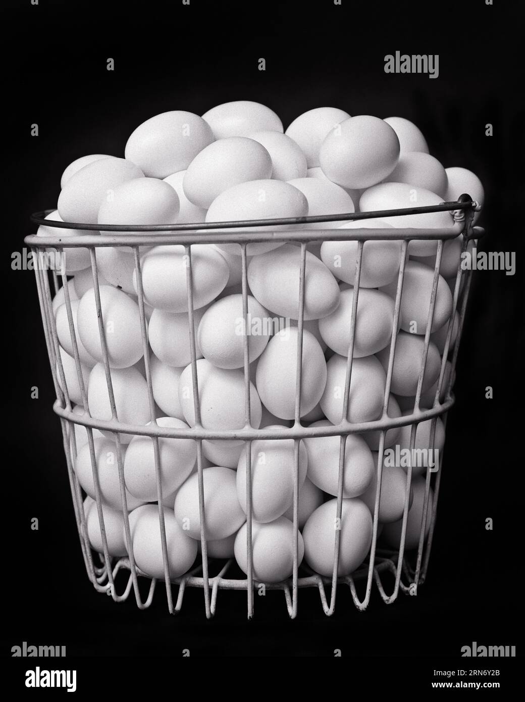 1950s A LARGE METAL WIRE BASKET FULL OF CHICKEN EGGS DON’T PUT ALL YOUR