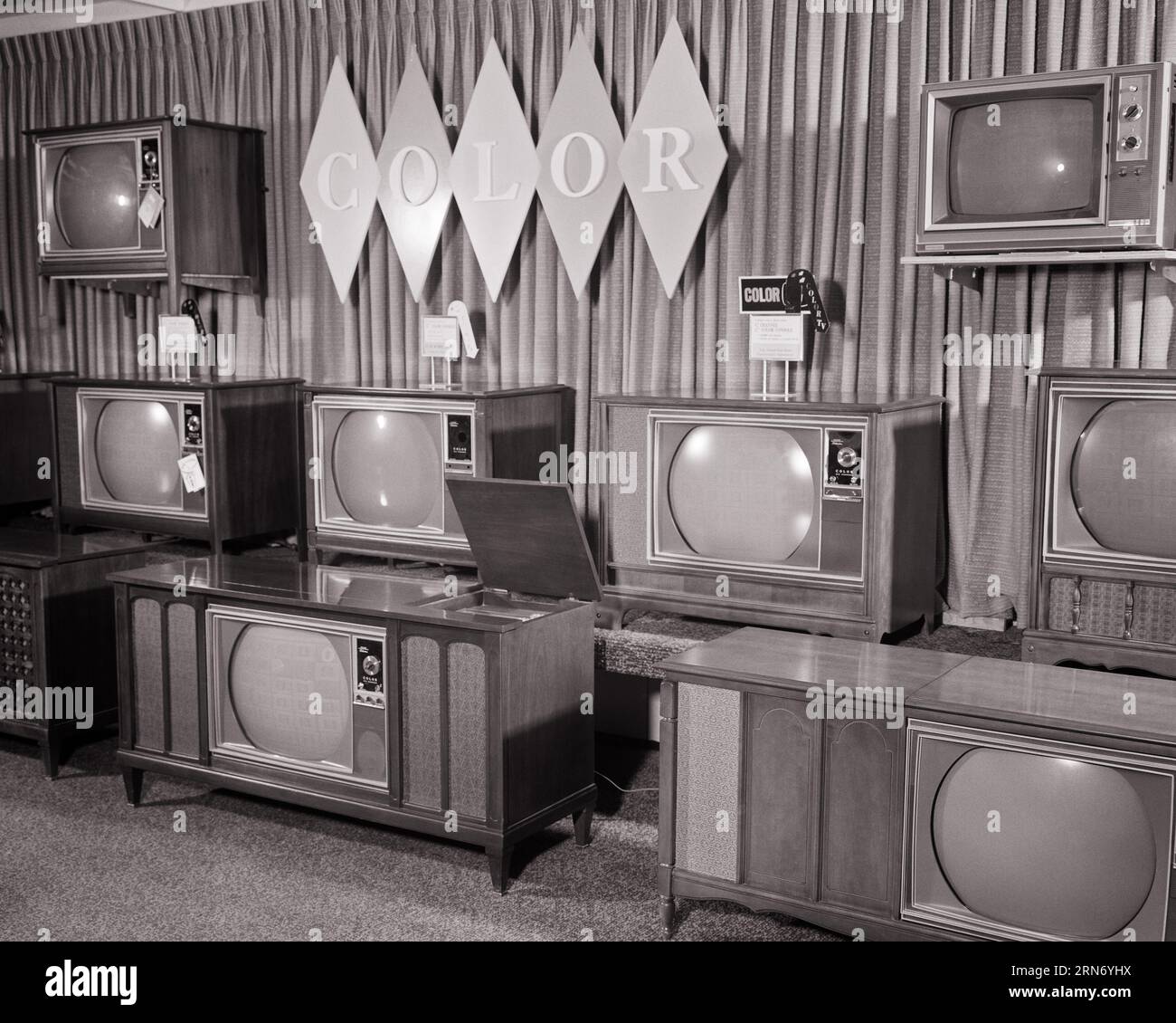 1960s DEPARTMENT STORE SELLING COLOR TELEVISIONS PORTABLES AND CONSOLES - s15142 HAR001 HARS OLD FASHIONED Stock Photo