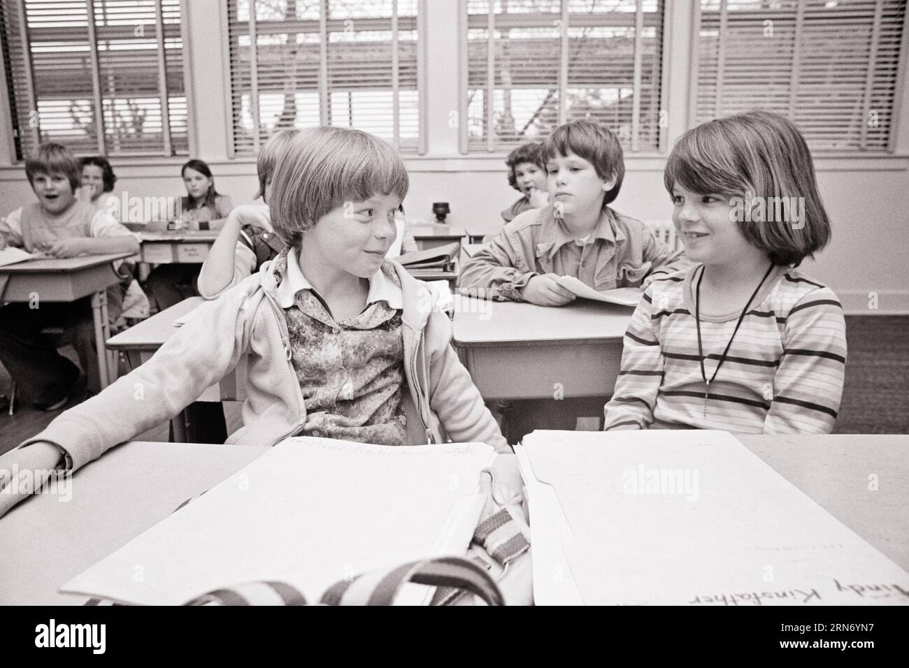 1970s SMILING HAPPY ELEMENTARY SCHOOL CLASSROOM BOYS AND GIRLS STUDENTS TWO STUDENTS SMILING AT ONE ANOTHER - s21226 HAR001 HARS JOY LIFESTYLE FEMALES WINNING COPY SPACE FRIENDSHIP HALF-LENGTH CARING MALES B&W SCHOOLS GRADE HAPPINESS AND OPPORTUNITY PRIMARY CONNECTION FRIENDLY CRUSH PLEASANT AGREEABLE CHARMING COOPERATION GRADE SCHOOL GROWTH JUVENILES LOVABLE PLEASING TOGETHERNESS ADORABLE APPEALING BLACK AND WHITE CAUCASIAN ETHNICITY CLASSMATES HAR001 OLD FASHIONED Stock Photo