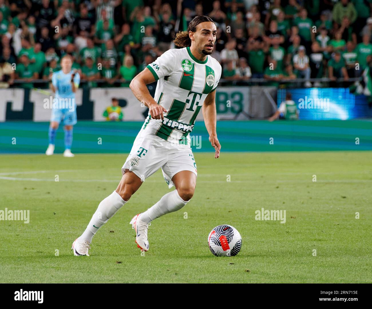 Budapest, Hungary. 31st August, 2023. Barnabas Varga of Ferencvarosi TC  competes for the ball with Nassim Hnid of FK Zalgiris Vilnius during the  UEFA Europa Conference League Play Off Round Second Leg