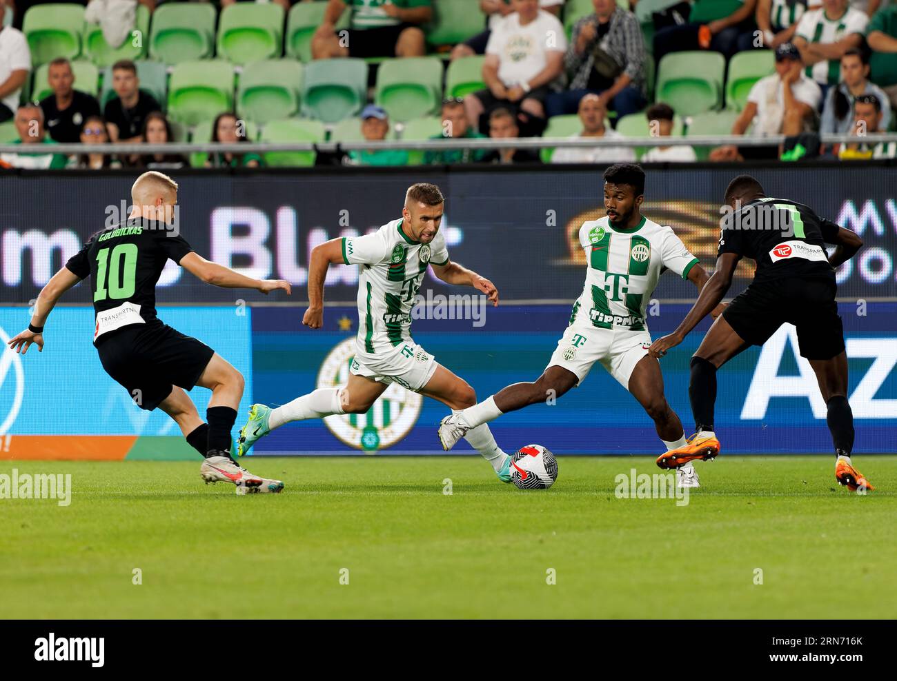 Budapest, Hungary. 31st August, 2023. Jose Marcos Marquinhos of Ferencvarosi TC (r2) and Eldar Civic of Ferencvarosi TC (l2) is challenged by Joel Bopesu of FK Zalgiris Vilnius and Paulius Golubickas of FK Zalgiris Vilnius during the UEFA Europa Conference League Play Off Round Second Leg match between Ferencvarosi TC and FK Zalgiris Vilnius at Groupama Arena on August 31, 2023 in Budapest, Hungary. Credit: Laszlo Szirtesi/Alamy Live News Stock Photo