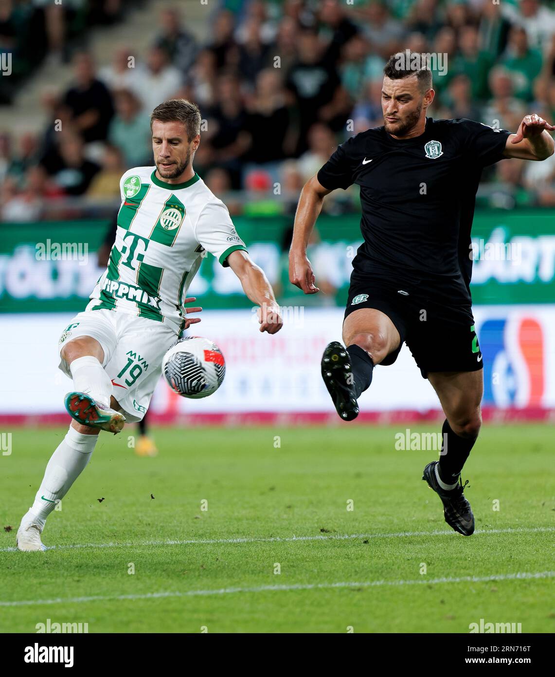 Budapest, Hungary. 31st August, 2023. Nassim Hnid of FK Zalgiris Vilnius tries to block the shot from Barnabas Varga of Ferencvarosi TC during the UEFA Europa Conference League Play Off Round Second Leg match between Ferencvarosi TC and FK Zalgiris Vilnius at Groupama Arena on August 31, 2023 in Budapest, Hungary. Credit: Laszlo Szirtesi/Alamy Live News Stock Photo