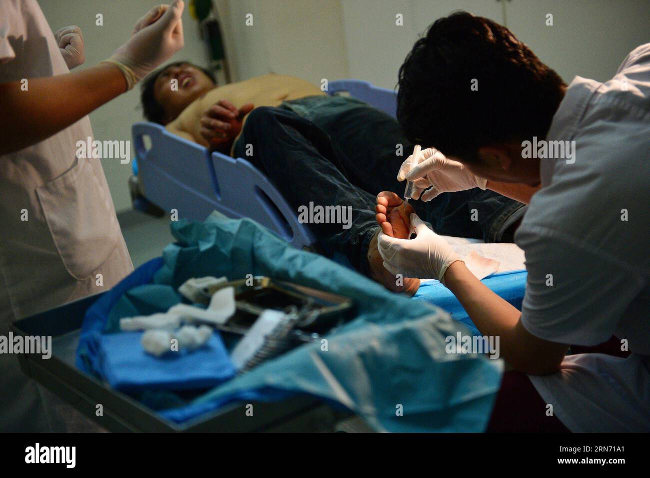 (150813) -- TIANJIN, Aug. 13, 2015 () -- A man injured in the explosion of the Binhai new district receives treatment in Tianjin Taida Hospital in north China s Tianjin Municipality, Aug. 13, 2015. The death toll has climbed to 44 from two massive blasts that ripped through a warehouse in north China s port city of Tianjin as of Thursday noon, according to rescue headquarters. Twelve firefighters were among the dead. () (zwx) CHINA-TIANJIN-EXPLOSION(CN) Xinhua PUBLICATIONxNOTxINxCHN   150813 Tianjin Aug 13 2015 a Man Injured in The Explosion of The Binhai New District receives Treatment in Tia Stock Photo