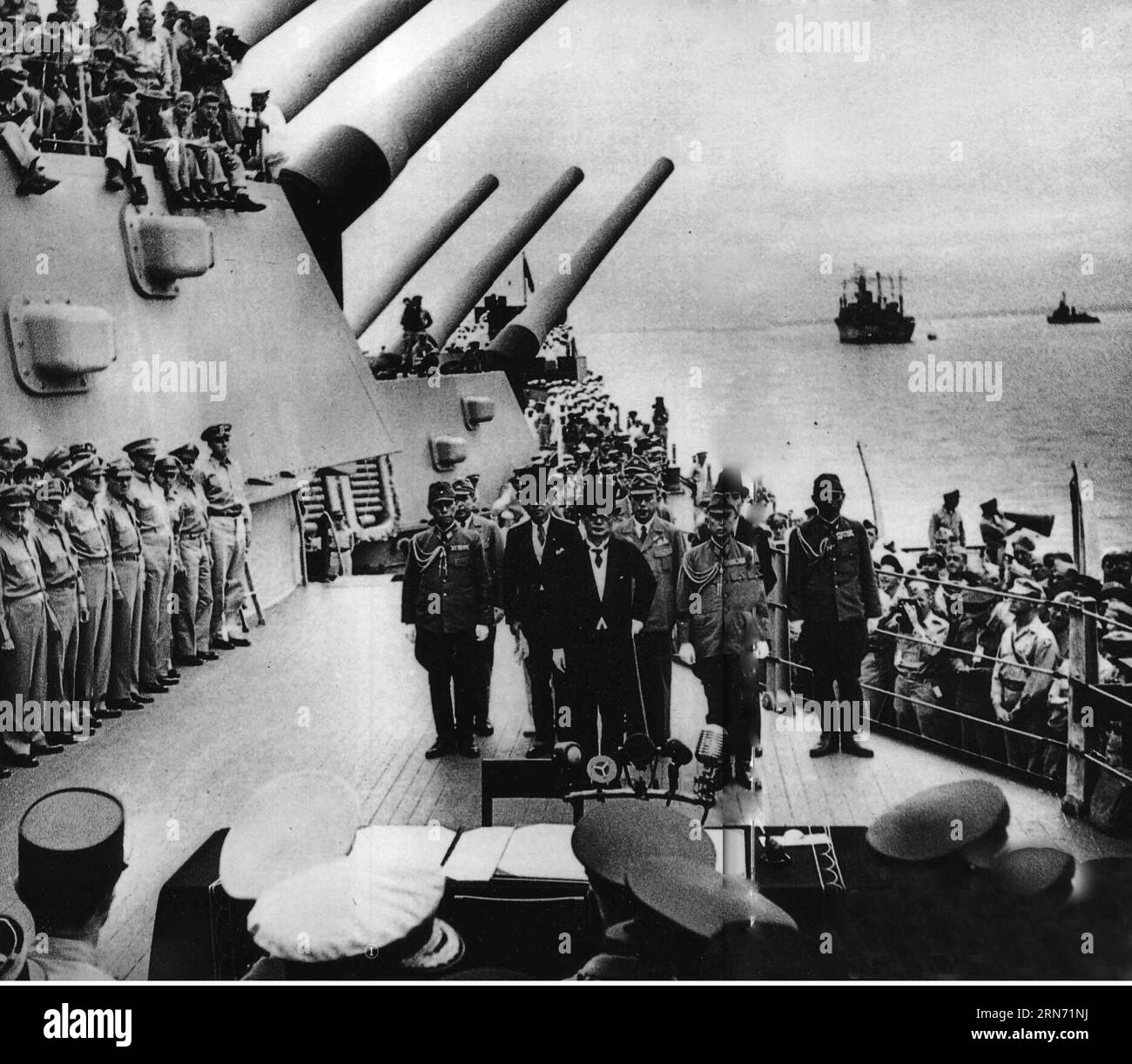 File photo taken on Sept. 2, 1945 shows Japan s surrender ceremony aboard the United States Navy battleship USS Missouri anchored in Tokyo Bay. On Aug. 15, 1945, Japanese Emperor Hirohito delivered a recorded radio address to the nation, announcing the surrender of Japan in World War II, one day after Japan declared its acceptance of the provisions of the Potsdam Proclamation jointly issued by China, the United States and Britain on July 26, 1945, with the Soviet Union joining later. The proclamation, which radicated Japan s crimes of aggressions during WWII and determined the principles under Stock Photo