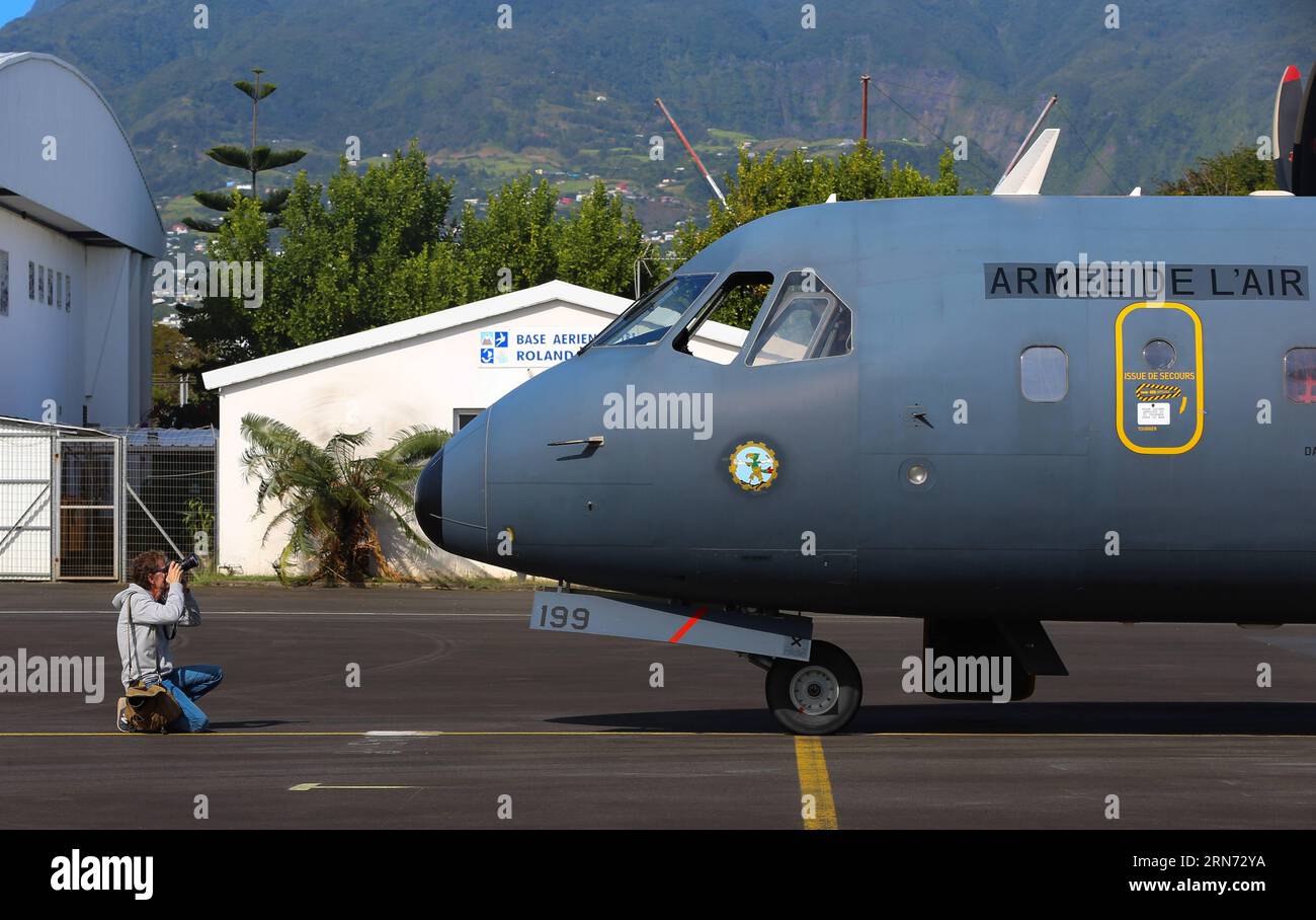 (150814) -- LA REUNION, Aug. 14, 2015 -- A photographer takes photos of a CASA search plane taking part in the searching mission at an airport in Saint Denis, La Reunion, Aug. 14, 2015. The administrator of Reunion Island Dominique Sorain told the media on Friday the active search for more MH370 debris will continue until Monday. No debris related to the plane has been found in the sea during the 35 hours of a combined search by a CASA search plane of French army and three helicopters, he said. ) (djj) LA REUNION-MH370 DEBRIS-SEARCH PanxSiwei PUBLICATIONxNOTxINxCHN   150814 La Reunion Aug 14 2 Stock Photo