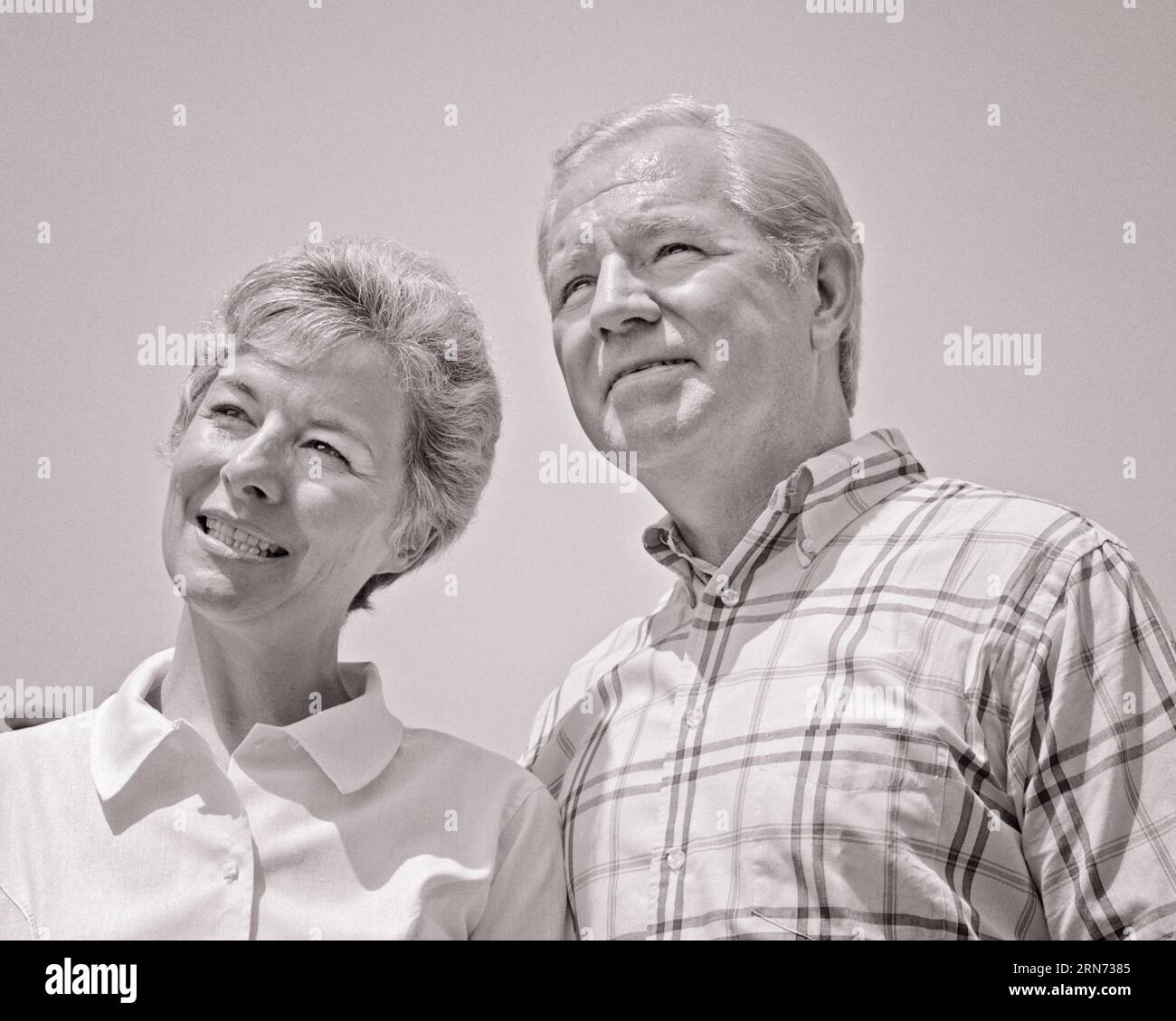 1960s PORTRAIT OF SMILING RETIRED COUPLE MAN AND WOMAN - p7576 HAR001 HARS COPY SPACE FRIENDSHIP LADIES PERSONS MALES RETIREMENT SENIOR MAN SENIOR ADULT B&W PARTNER SENIOR WOMAN RETIREE HAPPINESS OLD AGE OLDSTERS HEAD AND SHOULDERS CHEERFUL OLDSTER AND LOW ANGLE SMILES ELDERS JOYFUL SUPPORT TOGETHERNESS WIVES BLACK AND WHITE CAUCASIAN ETHNICITY HAR001 OLD FASHIONED Stock Photo